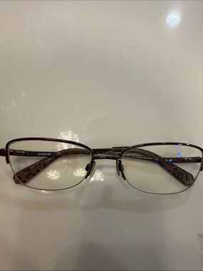 bebe Men's Shiny Brown Metal Frame Glasses with Leopard Temples